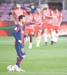  ?? — AFP photo ?? Barcelona’s Lionel Messi reacts a er Granada’s Jorge Molina scored during the Spanish La Liga match at the Camp Nou stadium in Barcelona. Granada won 2-1.