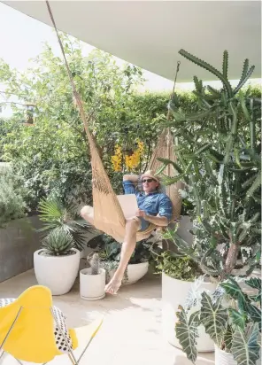  ??  ?? terrace
Tall, lush plants make this a cool green haven. ‘I’d wanted a place in Miami for years and when I saw this terrace, I knew I’d found what I wanted,’ says David. ‘It doubles the size of the apartment and is my tropical escape from New...