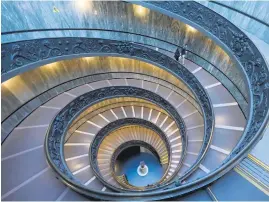 ?? ?? RAPID WHIRL. The Bramante staircase at the Vatican Museums.