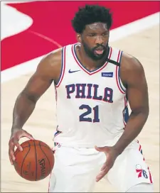  ?? KIM KLEMENT — POOL PHOTO VIA AP ?? 76ers center Joel Embiid (21) dribbles the ball against the Houston Rockets during the first half of Friday’s game.