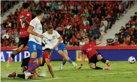  ?? ?? Fermín López scores Barcelona’s second-half equaliser against Real Mallorca. Photograph: Albert Gea/Reuters