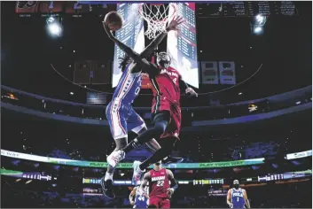  ?? MATT SLOCUM/AP ?? MIAMI HEAT’S VICTOR OLADIPO (4) goes up for a shot against Philadelph­ia 76ers’ Tyrese Maxey during the second half of Game 6 of a second-round playoff series on Thursday in Philadelph­ia.