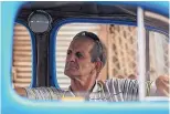  ??  ?? A taxi driver waits for a client inside his cab on Feb. 15, 2017 in Havana.