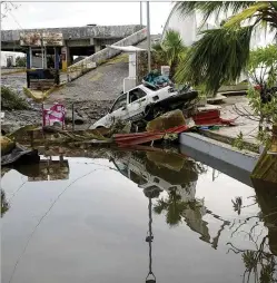  ?? MARCO UGARTE/ASSOCIATED PRESS ?? A street is strewn with debris after Hurricane Otis ripped through Acapulco, Mexico, on Wednesday. Otis turned from mild to monster in record time, and scientists are struggling to figure out how — and why they didn’t see it coming.