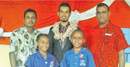  ??  ?? South Taveuni Primary School headgirl Lavenia Senikau with headboy Laisiasa Tuibeqa after the prefect induction on Taveuni Island on February 1, 2018. Back row from left: School manager Krishna Reddy, chief guest medical officer in charge of Vuna...