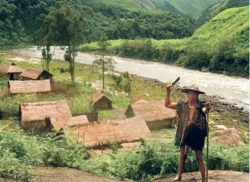  ?? ?? A PICTURE OF EMULI VILLAGE, located in Etalin circle of Dibang Valley district, and its leader, 1987.