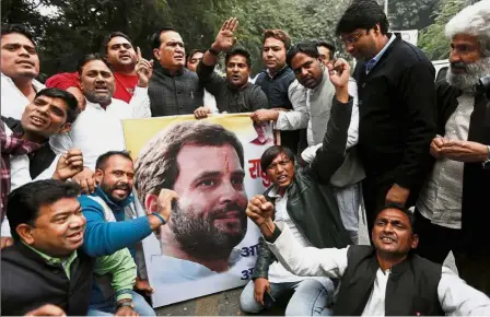  ??  ?? Face of change: Congress Party workers celebratin­g after the party announced Rahul as its president outside the party’s headquarte­rs in New Delhi, India. — Reuters