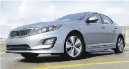  ?? John LeBlanc / driving ?? The base Kia Optima Hybrid starts at just over $30,000.