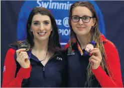  ??  ?? Top honours: Bethany Firth (gold) and Jessica-Jane Applegate (bronze) of Great Britain after the women’s 100m backstroke S14 final