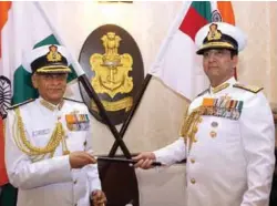  ??  ?? Chief of the Naval Staff Admiral Sunil Lanba being handed over the baton by the outgoing Chief of Naval Staff Admiral R.K. Dhowan on May 31, 2016