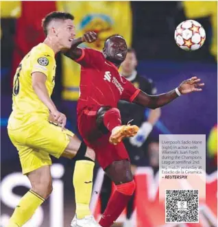  ?? – REUTERSPIX ?? Liverpool’s Sadio Mane (right) in action with Villarreal’s Juan Foyth during the Champions League semifinal 2nd leg match yesterday at Estadio de la Ceramica.