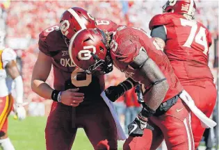  ?? [PHOTO BY BRYAN TERRY, THE OKLAHOMAN] ?? OU freshman wide receiver CeeDee Lamb injured his shoulder scoring a touchdown in the first quarter of Saturday’s loss to Iowa State. Coach Lincoln Riley didn’t have an update on his status Monday.