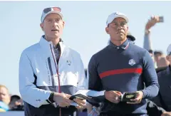  ?? AP ?? US captain Jim Furyk, left, and Tiger Woods at Le Golf National yesterday.