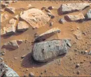  ?? AFP ?? Two holes where the Perseveran­ce rover’s drill obtained chalksize samples from the rock nicknamed Rochette.