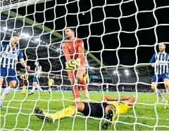  ??  ?? Disbelief: Adrian Mariappa and goalkeeper Ben Foster react after the Watford defender turns the ball into his own net