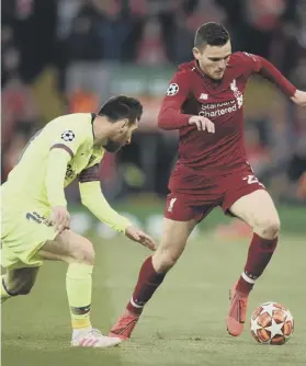  ??  ?? 0 Andrew Robertson gets the better of Lionel Messi on Tuesday evening.