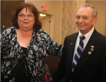  ?? LOWELL SUN FILE PHOTO ?? ADDRESSING A PROBLEM: Dracut state Rep. Colleen Garry, above with American Legion member Joe Zangri, plans to introduce legislatio­n establishi­ng a commission on PTSD.