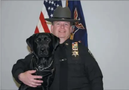  ?? PHOTO PROVIDED ?? Rensselaer County Sheriff’s Office Deputy Paul Davendonis is shown with his new canine Halli after graduation at the New York State Academy of Fire Science.