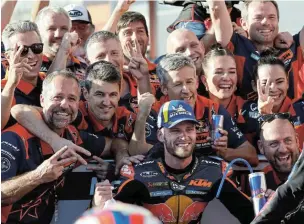  ?? Picture: REUTERS/ISSEI KATO ?? YOU GO, BRAD: Red Bull KTM Factory Racing’s Brad Binder of SA celebrates his second place with his team after the Motogp of Japan, in Motegi, on Sunday.