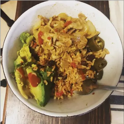  ?? PHOTOS BY NATALIE HANSON — ENTERPRISE-RECORD ?? Burrito bowls are easy to make vegan with rice, beans, chilies, bell peppers and more.