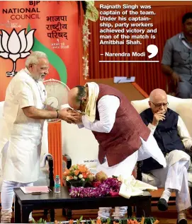  ??  ?? Prime Minister Narendra Modi greets BJP president Amit Shah after the formal announceme­nt of his appointmen­t at the party’s national council meet in New Delhi on Saturday. Senior party leader L. K. Advani can also be seen.