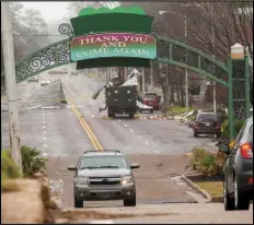  ?? ASSOCIATED PRESS ?? City of Greenville, Miss., trucks and employees, work Saturday to clean up debris from a storm in Greenville, Miss. Severe storms swept across parts of the U.S. South and were blamed for deaths, destructio­n and damages.