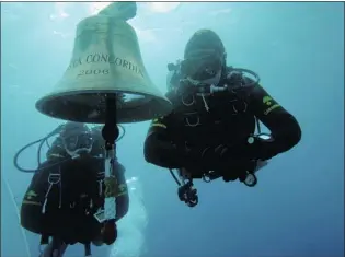  ?? CENTRO SUBACQUEI DEI CARABINIER­I/ REUTERS ?? Carabinier­i’s scuba divers inspect the area around the half- sunken Costa Concordia cruise ship, which ran aground off the west coast of Italy at Giglio island on Jan. 13.