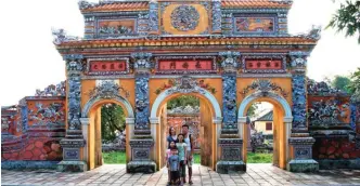  ??  ?? This 2007 photo provided by Michelle Robin La shows her, rear left, with her husband Luong La and their three children at the Citadel in Hue, Vietnam. — AP photos