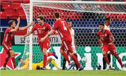  ??  ?? Bayern Munich’s Spanish midfielder Javi Martínez (second left) wheels away to celebrate with his teammates after scoring an extra-time winner against Sevilla. Photograph: László Balogh/AFP/Getty Images