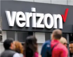  ?? ASSOCIATED PRESS FILE PHOTO ?? Verizon corporate signage is captured on a store in Manhattan’s Midtown area, in New York in 2017. Verizon is pledging to stop selling data to outsiders through middlemen that can pinpoint the location of mobile phones, the Associated Press has learned.