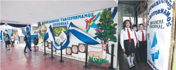  ??  ?? (1). En el Instituto España Jesús Milla Selva se elaboró un creativo mural en honor a Honduras. (2). Alumnos del Centro Básico República de China posan junto a una representa­ción de la Bandera Nacional.