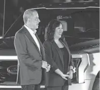  ?? JUNFU HAN/DETROIT FREE PRESS ?? Bill Ford, who now goes by executive chair rather than chairman, stands next to Linda Zhang, chief engineer of F-150, after Ford Motor Co. unveils the electric F-150 Lightning at its World Headquarte­rs in Dearborn on May 19.