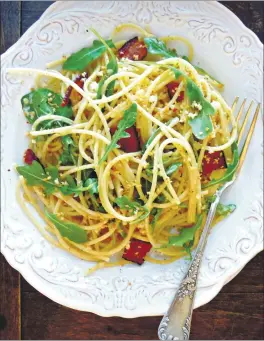  ?? COURTESY OF LYNDA BALSLEV ?? This take on the classic aglio e olio adds bacon and arugula to the mix for a delicious, easy meal.