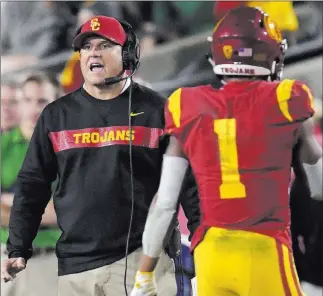  ?? Mark J. Terrill ?? Southern California will keep Clay Helton as coach after the Trojans went 5-7. The Associated Press