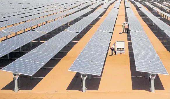  ?? PHOTOS BY REUTERS ?? Rows of photovolta­ic solar panels are seen at the Benban plant in Aswan.