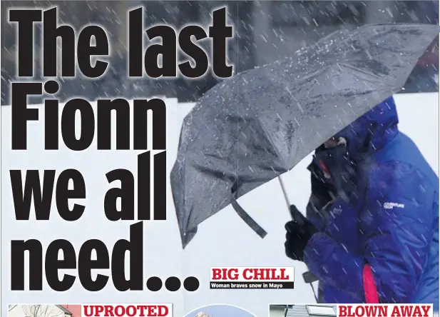  ??  ?? BIG CHILL Woman braves snow in Mayo