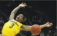  ?? Ben Margot / Associated Press ?? Cal’s Paris Austin, who returned from a sprained ankle, loses the ball in the first half of the Bears’ 22-point loss to Arizona.