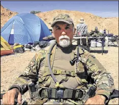  ?? KEN RITTER / ASSOCIATED PRESS 2014 ?? Gerald DeLemus was one of several self-described militia members camping on Cliven Bundy’s ranch near Bunkervill­e, Nev.