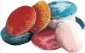  ??  ?? Round lush velvet pillows West Elm, $53