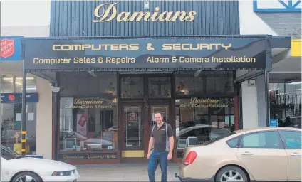  ??  ?? DAMIAN outside his High Street shop ready to help with computing needs and security.