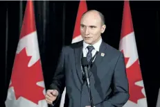  ?? THE CANADIAN PRESS FILES ?? Social Developmen­t Minister Jean-Yves Duclos speaks to reporters at a Liberal cabinet retreat in Calgary on Jan. 24, 2017. A spokesman for Duclos said that officials are looking at different options for paternity leave and would provide more details...