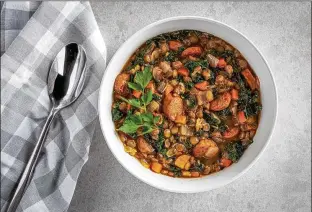  ?? REY LOPEZ/WASHINGTON POST ?? Brown or green dried lentils will have the quickest cooking time, while smaller French du Puy lentils will take longer. Chicken sausage can be left out to make the soup vegan.