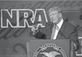  ?? PHOTOS BY MICHAEL WYKE/AP ?? “The existence of evil is one of the very best reasons to arm law-abiding citizens,” former president Donald Trump said at the National Rifle Associatio­n Annual Meeting on Friday in Houston.