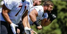  ?? AP ?? New Bengals center Ted Karras, one of three offensive line starters acquired this offseason, likens Joe Burrow to Tom Brady.