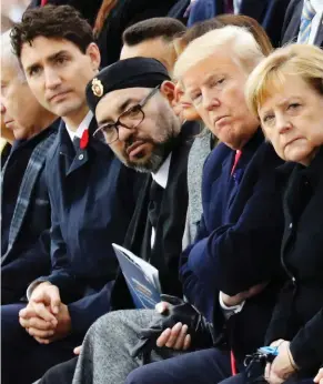  ?? LUDOVIC MARIN / THE ASSOCIATED PRESS FILES ?? Prime Minister Justin Trudeau with world leaders in November. Relatively highpaying resource jobs have kept Canadian politics on an even keel, a study suggests.