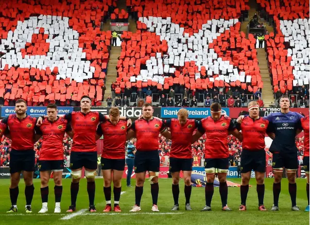  ??  ?? LEGEND: The Munster team during a minute’s silence in memory of the late Munster Rugby coach Anthony Foley before yesterday’s European Rugby Champions Cup match