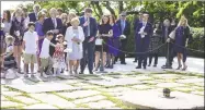  ?? Leigh Vogel / Getty Images for RFK Human Right ?? Ethel Kennedy places flowers at the gravesites of Jacqueline Kennedy, John F. Kennedy, and Patrick Kennedy on Wednesday.