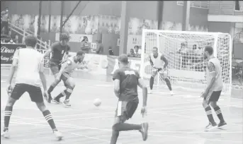  ?? ?? Keoma Gravesande (3rd from left) of Tiger Bay trying to shield the ball while being challenged by a Renegades player in the GFF/Kashif and Shanghai Organizati­on Futsal Championsh­ip