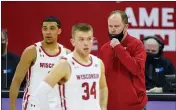  ?? ANDY MANIS — THE ASSOCIATED PRESS FILE ?? Wisconsin coach Greg Gard talks with D’Mitrik Trice, left, and Brad Davison during the second half of the team’s NCAA college basketball game against Iowa in Madison, Wisc., in this Feb. 18 file photo.