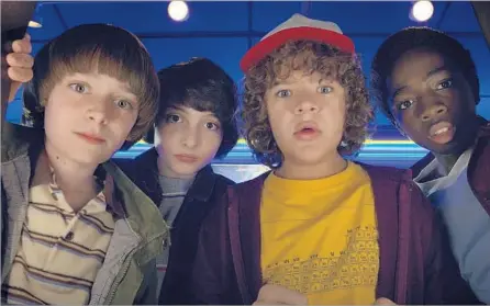  ?? Photograph­s by Netflix ?? “STRANGER THINGS” cast mates Noah Schnapp, from left, Finn Wolfhard, Gaten Matarazzo and Caleb McLaughlin in Season 2.